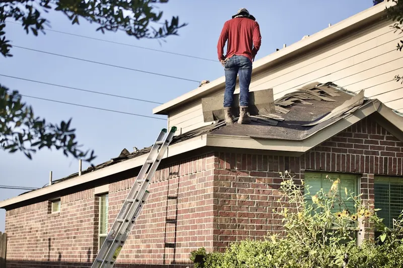 Professional roofer working on a residential roof in Des Plaines
